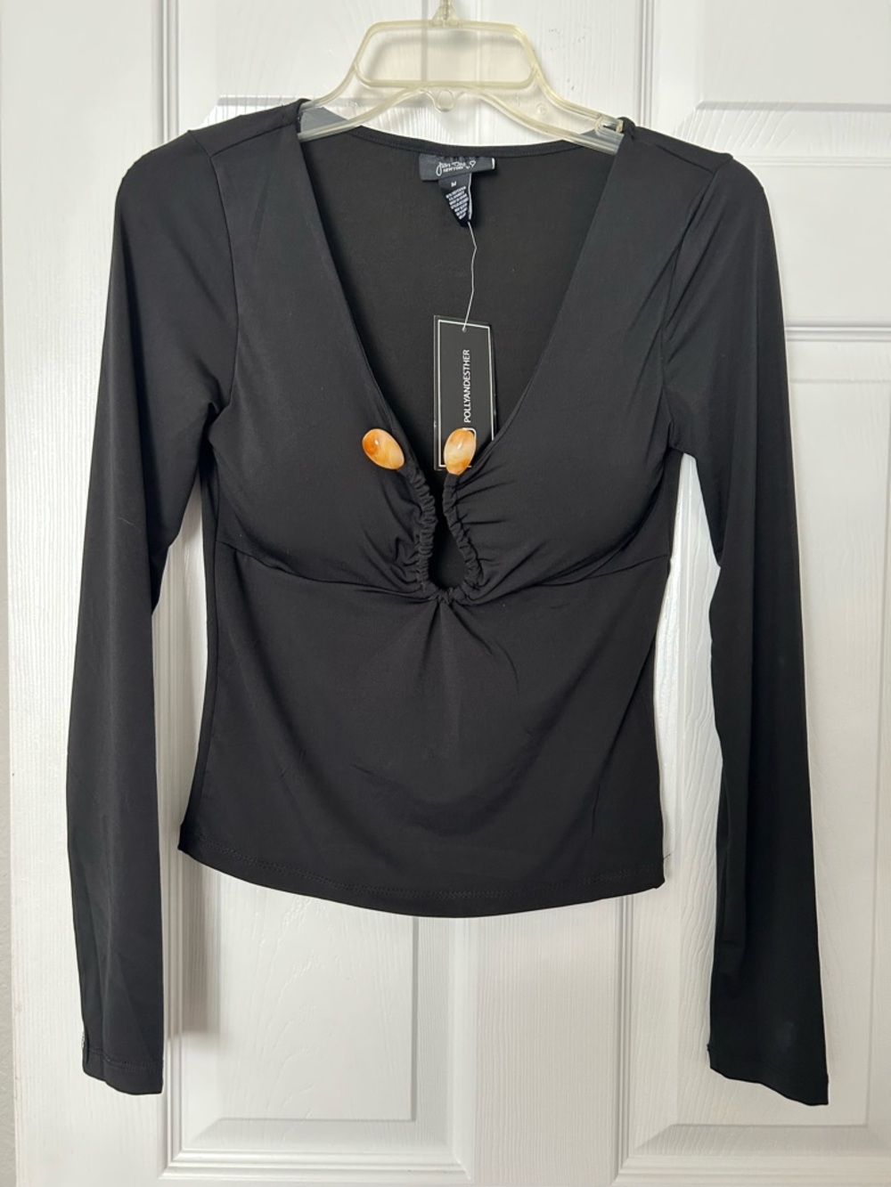 Just Polly NY,  Black Ruched V-Neck Long Sleeve Top with Center Ring Accents/ M